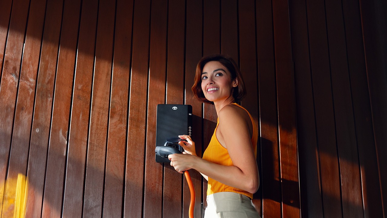 Woman using the Toyota Homecharge