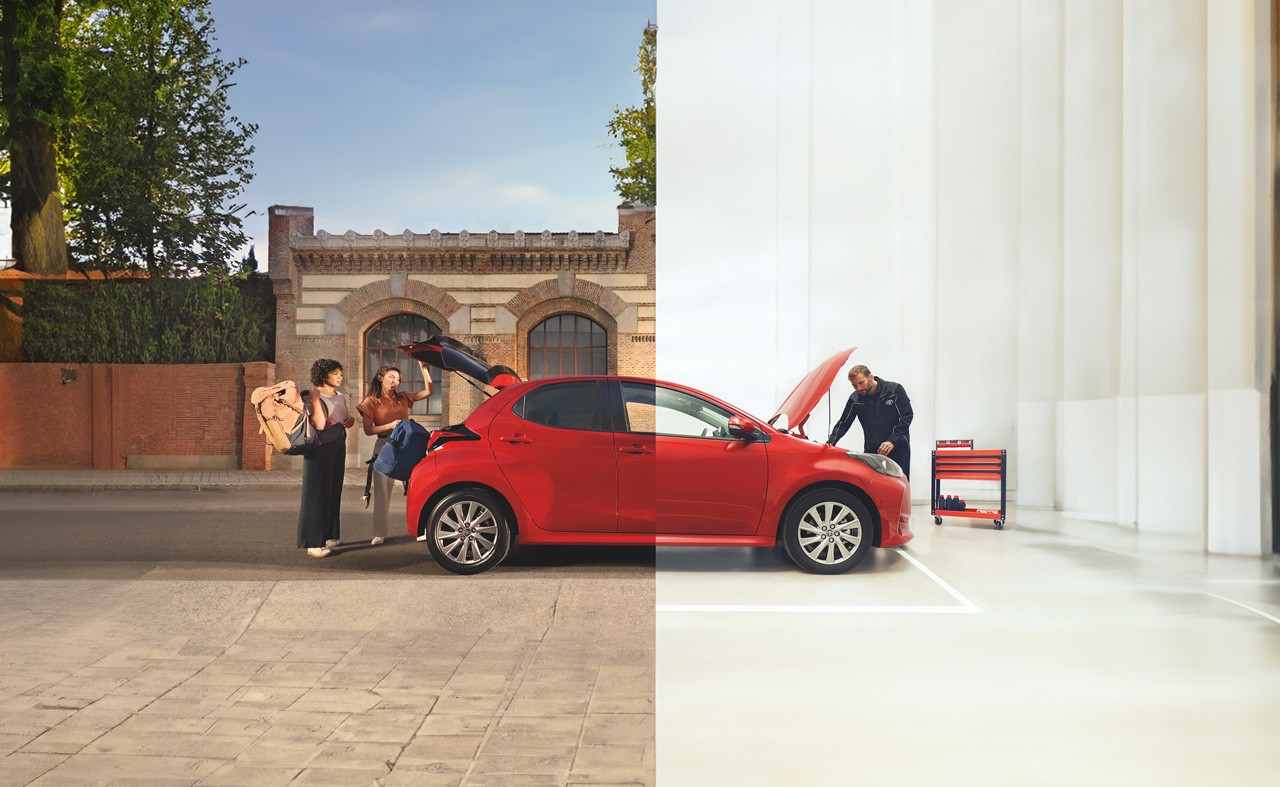 This image is split in half The left side shows two people remvoing belongs from the boot of a toyota parked on a road. The right side shows the front of the car beig checked by a mechanic parked in a workshop